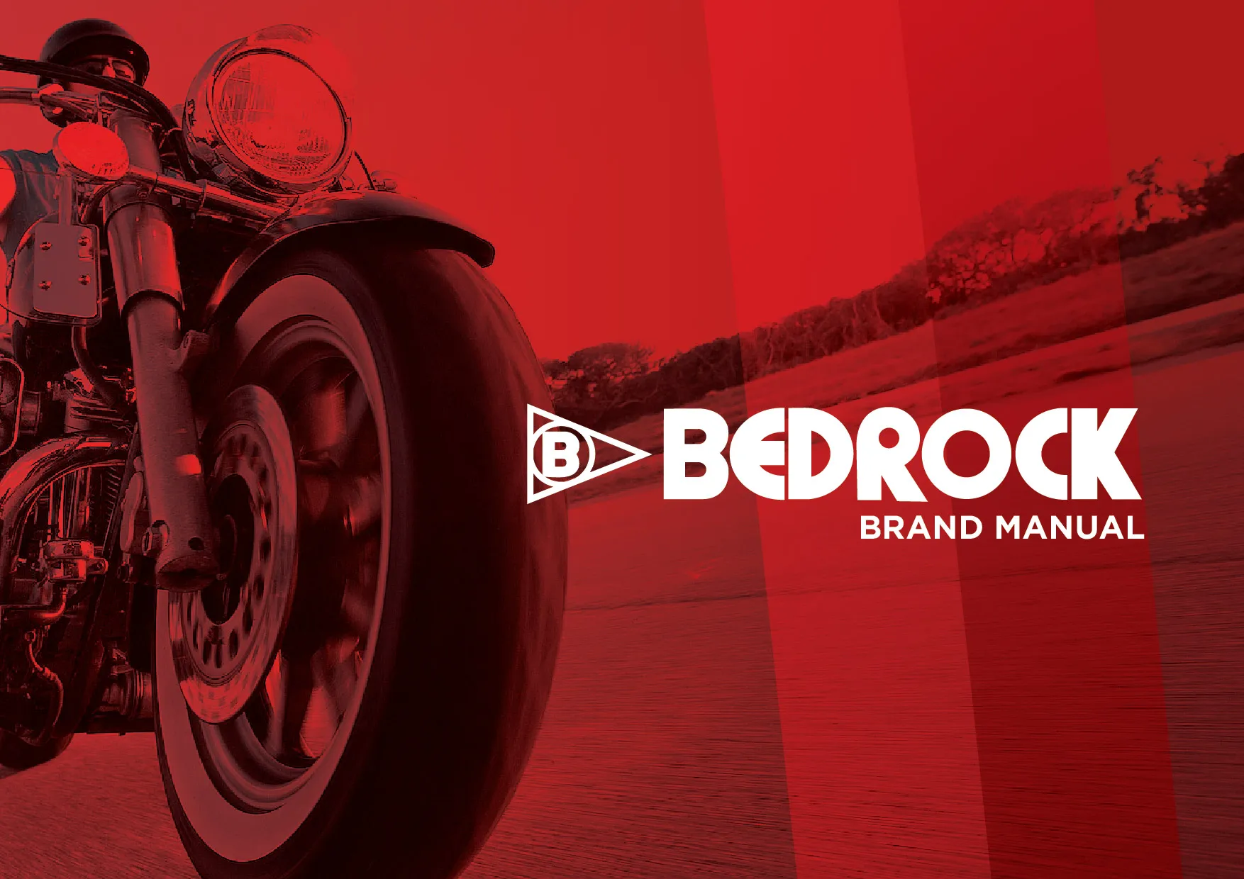 Bedrock brand manual cover: a red-duotone photo of a motorcycle front wheel and rider, with the white Bedrock pennant logo.
