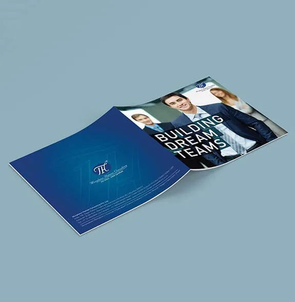 Square Morpheus brochure on a dusty slate background: a deep blue back cover with a large watermark monogram.