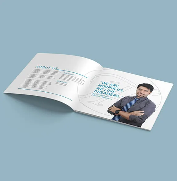 Open square brochure spread with an About Us page covering the company’s philosophy and dream, beside a founder-quote page reading “We are Morpheus. We love dreamers.”