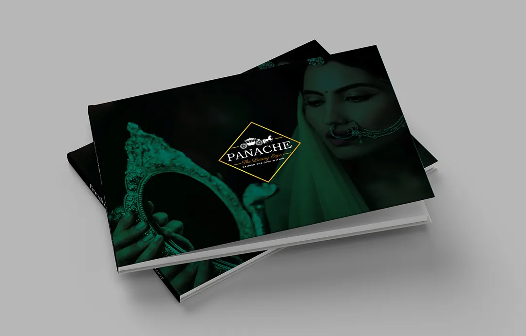 Stacked brochures with a dark green-tinted cover of a woman in bridal jewellery holding an ornate mirror, with gold Panache lettering.