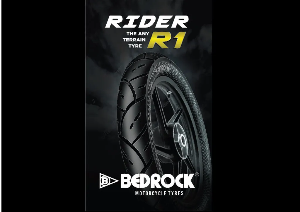 Product poster for the Bedrock Rider R1, “the any terrain tyre”: a motorcycle tyre and alloy wheel against a dark cloudy background.