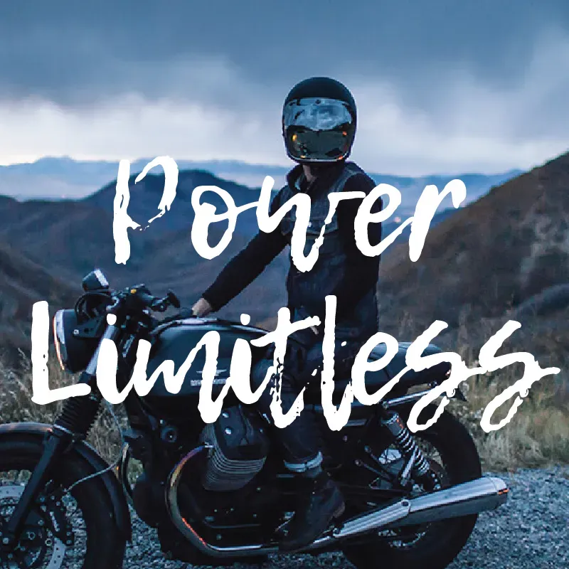 PODD campaign visual: a motorcyclist at dusk in the mountains with the line “Power Limitless” in white brush lettering.
